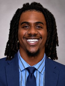 Professional portrait with a navy tie 228x300
